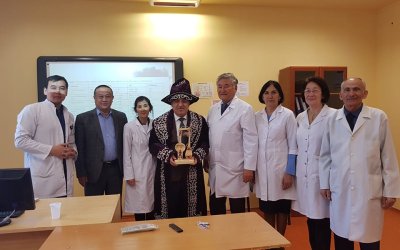 KAZAKİSTAN'DA FERRUH YÜCEL HOCAMIZ'A TEŞEKKÜR BELGESİ VERİLDİ